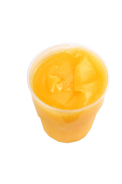 istock yellow honey in plastic figured container isolated on white background at dry sunny day 1132290237