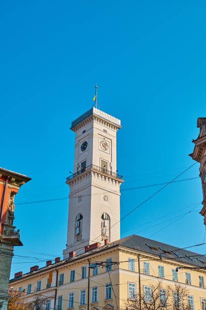 municipio di leopoli - autumn clock roof colors foto e immagini stock