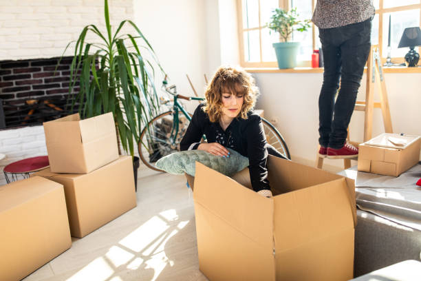 istock Unpacking boxes in new home 1132293791
