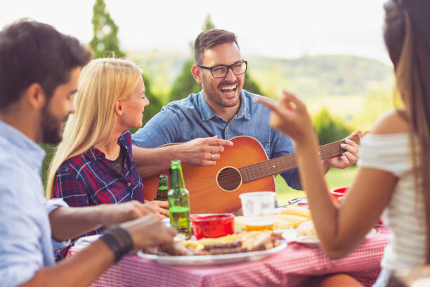istock Playing guitar at a barbecue party 1132294572