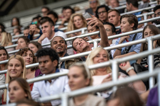 istock Two men taking a selfie in a football stadium 1132295634