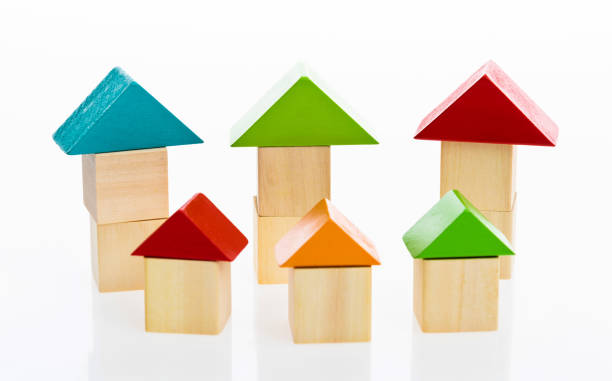 istock Wooden block houses on white background 1132295664