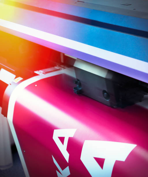 Large size printer printing Detail of a large size printer inkjet plotter printing digital printing house stock pictures, royalty-free photos & images