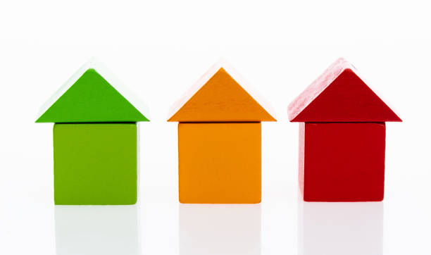 istock Wooden block houses on white background 1132296384