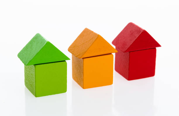 istock Wooden block houses on white background 1132296461