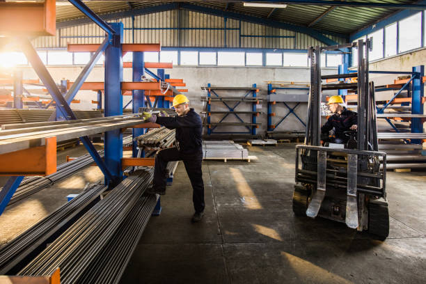 istock Two manual workers working in a steel mill. 1132296534