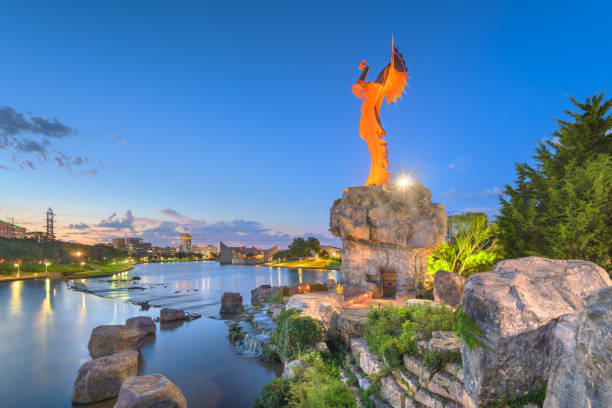 Keeper of the Plains Wichita, Kansas, USA - Augusst 31, 2018: The confluence of the Arkansas and Little Arkansas River at the Keeper of the Plains near downtown Wichita at dawn. wichita photos stock pictures, royalty-free photos & images
