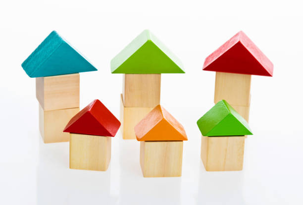 istock Wooden block houses on white background 1132297885
