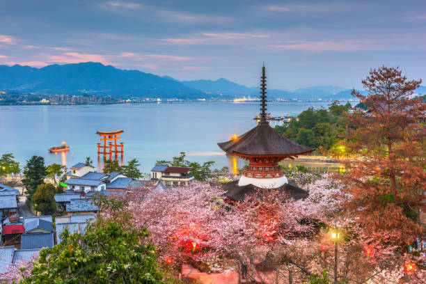 Hiroshima, Japan - April 5, 2017: The Seto inland Sea with the floating torii gate as seen from behind Tahoto Pagoda on Miyajima Island in spring season.