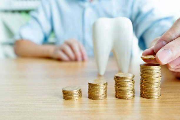 istock Saving money for dental health 1132298539