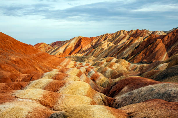 Rainbow Mountains in Zhangye Danxia Landform Geological Park. Panoramic View of Rainbow Mountains Geological Park. Stripy Zhangye Danxia Landform Geological Park in Gansu Province, China. Valley on a Sunny Day. zhangye danxia geopark china stock pictures, royalty-free photos & images