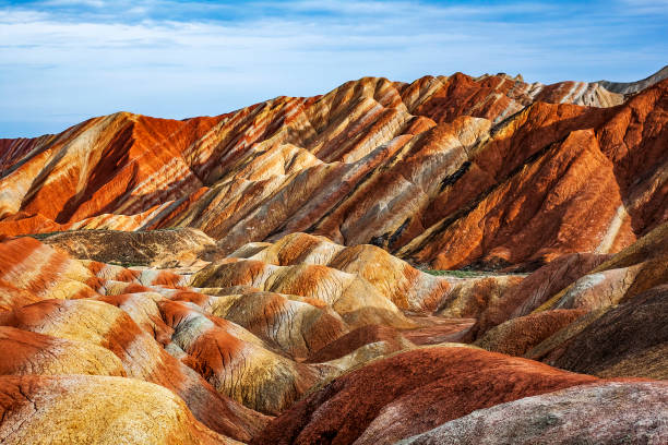 Rainbow Mountains in Zhangye Danxia Landform Geological Park. Fantastic View of Rainbow Mountains Geological Park. Stripy Zhangye Danxia Landform Geological Park in Gansu Province, China. Valley on a Sunny Day. zhangye danxia geopark china stock pictures, royalty-free photos & images