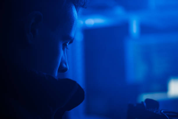 istock The process of filming. Cameraman shoots a scene with a hacker. 1132300526