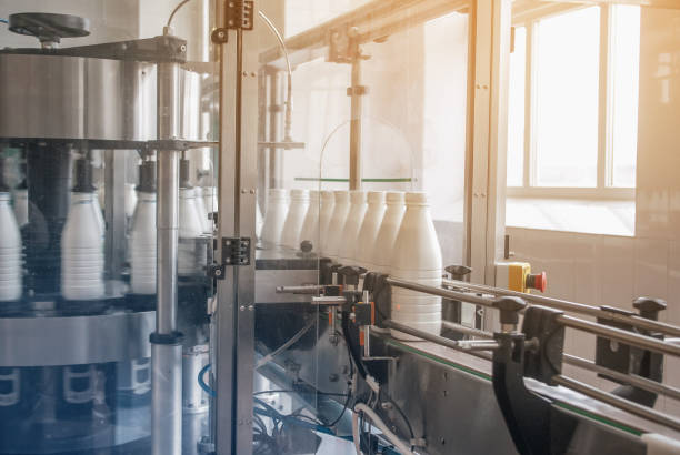 istock White plastic bottles with dairy product on the production line. Bottled on conveyor. 1132300836