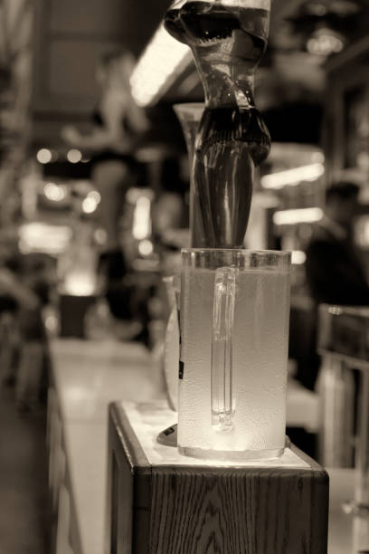 istock Glass with green beverage in a pub 1132300841