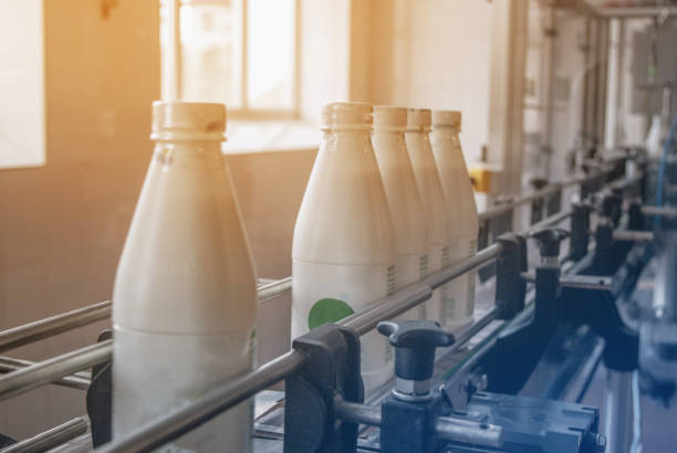istock White plastic bottles with dairy product on the production line. Bottled on conveyor. 1132301422