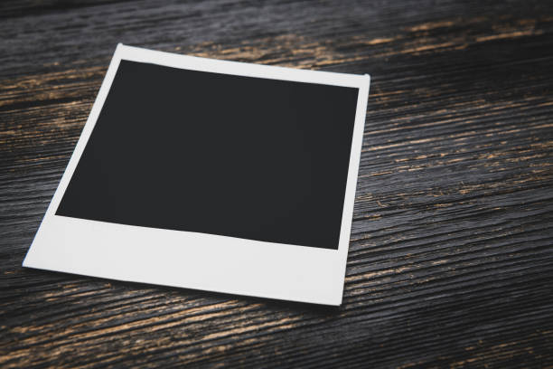istock Picture frame laying on wooden table 1132303189