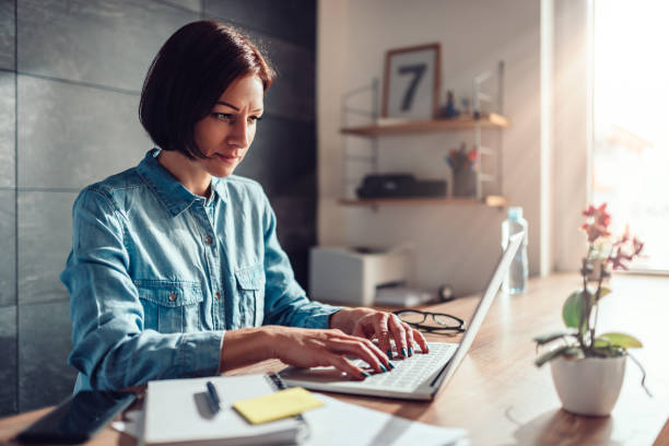istock Woman using laptop in the office 1132306723