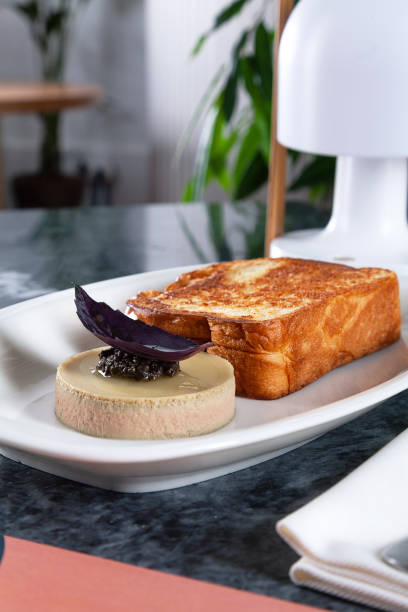 istock Delicious flat lay food for breakfast on marble table. Close up on Fried toast with pate, bread and coffee latte with copy space for design in modern interior. 1132307002