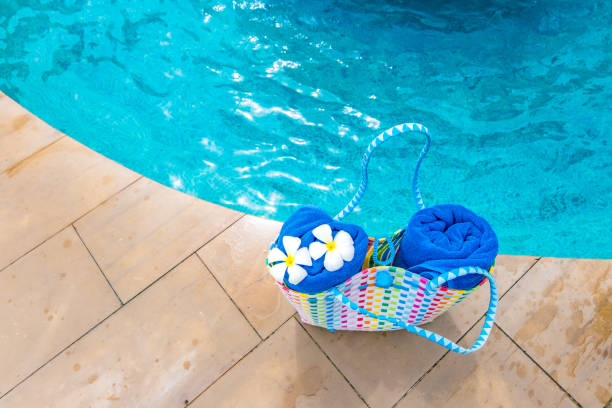 istock The Rolled towel placed on the bed in the pool 1132308799