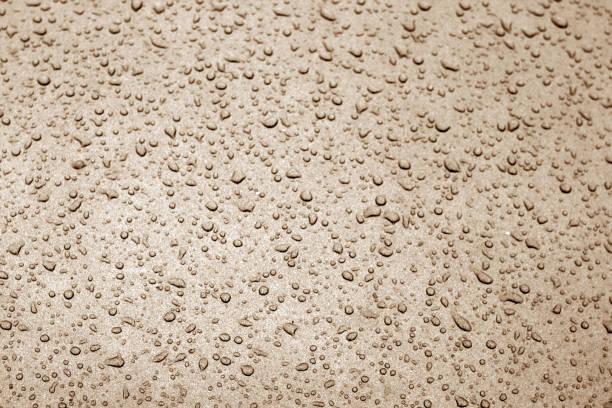 istock Water drops on car surface in brown tone. 1132311937