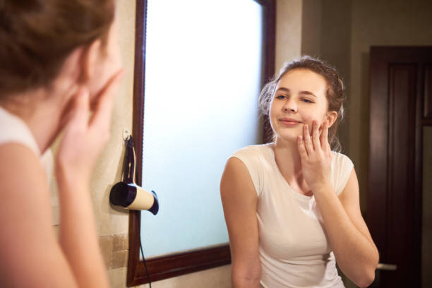 istock Woman admiring her face skin 1132312376