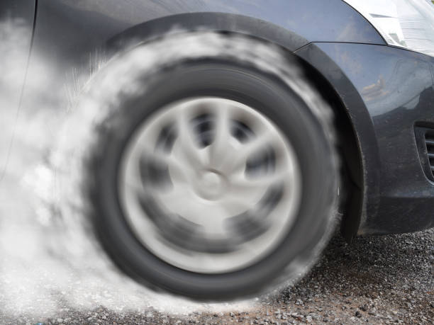 istock Car wheel drifting and smoking on track 1132313783