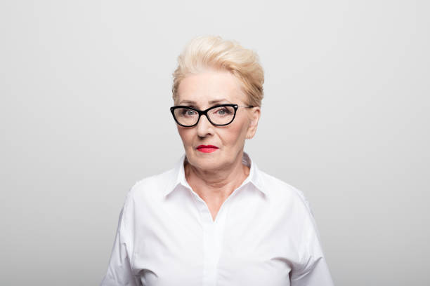 istock Serious businesswoman on white background 1132314541