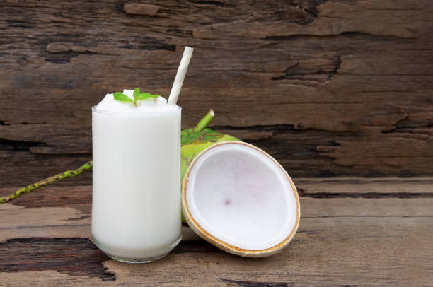 istock Coconut smoothies white fruit juice milkshake blend beverage healthy high protein the taste yummy In glass drink episode morning on a wooden background. 1132314650
