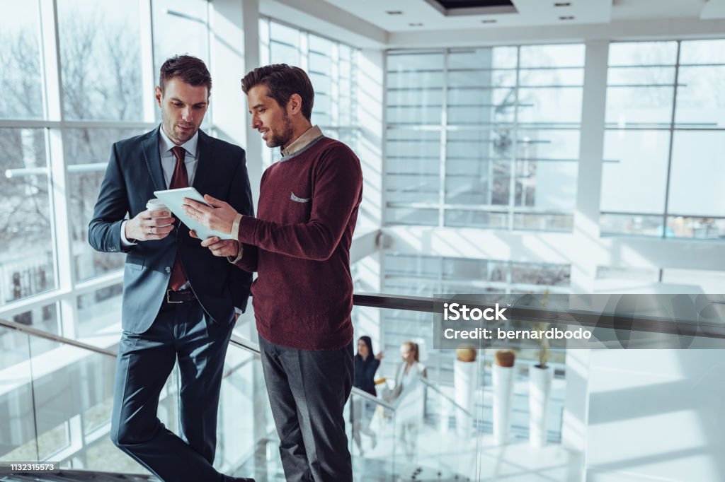 Thatâs one productive coffee date Business people using technology during their office break Business Stock Photo