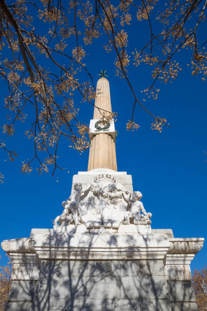 istock obelisk of Arganzuela with tree 1132315630
