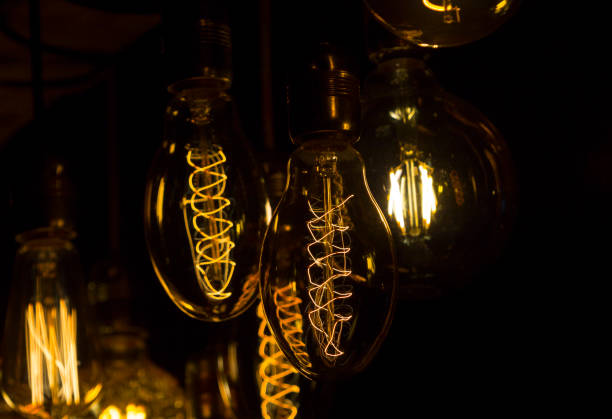 istock Close up of antique Edison bulbs with interesting visual effects. Obsolete technology reintroduced as marketing innovation for public spaces and home interiors. 1132317008
