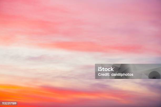 Sunset Sky With Pink Orange Light Clouds Colorful Smooth Blue Sky Gradient Natural Background Of Sunrise Amazing Heaven At Morning Slightly Cloudy Evening Atmosphere Wonderful Weather On Dawn Stock Photo - Download Image Now