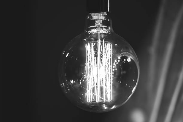 istock Close-up yellow light bulb on dark background. Christmas lights. 1132318838