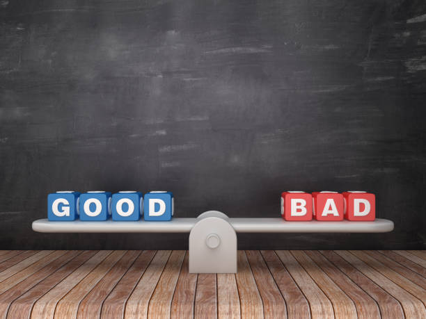 istock Seesaw Scale with GOOD BAD Cubes on Chalkboard Background - 3D Rendering 1132319089