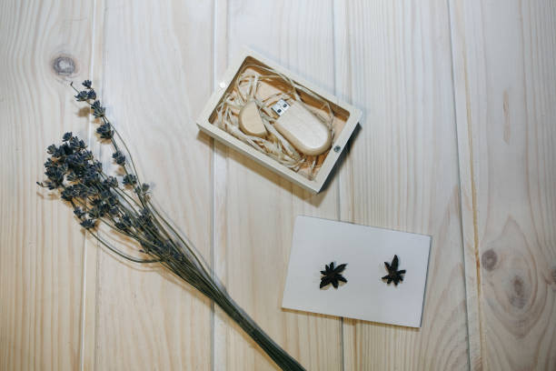 istock Decorative wooden box for presents, memory sticks or money. Ecological friendly package for wrapping. Lavender, anise-tree stars and cinnamon lying nearby. Rustic vintage style. 1132319414