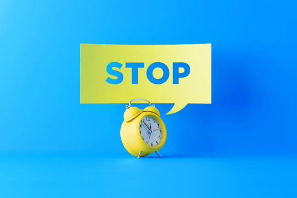 istock Yellow Alarm Clock And A Yellow Speech Bubble On Blue Background 1132319762