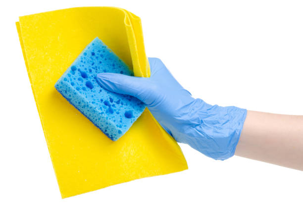 istock hand in cleaning glove with yellow rag blue clean sponge 1132320530