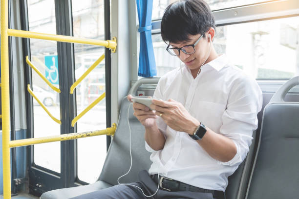 istock Businessman Using Phone While Traveling In Bus 1132321093