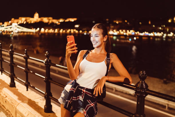 istock Tourist girl on video call from Budapest 1132321641
