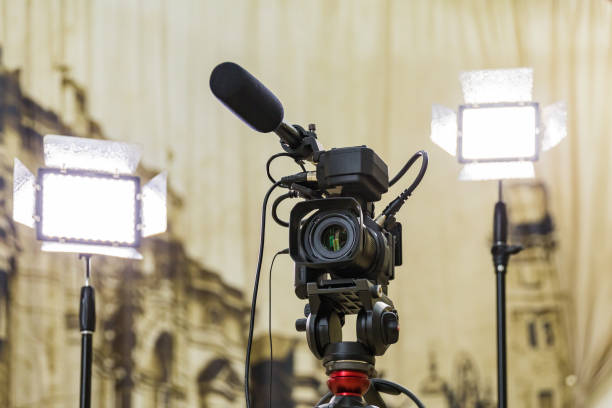 istock Shooting a report in the interior. Video equipment: camera, on-camera microphone gun, led lighting device, tripod 1132323411