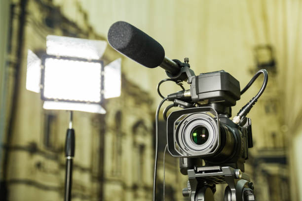 istock Shooting a report in the interior. Video equipment: camera, on-camera microphone gun, led lighting device, tripod 1132323412