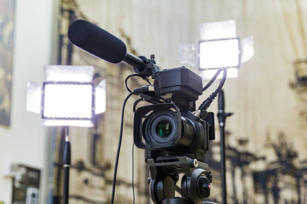 istock Shooting a report in the interior. Video equipment: camera, on-camera microphone gun, led lighting device, tripod 1132323428