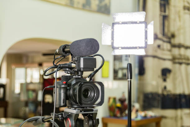 istock Shooting a report in the interior. Video equipment: camera, on-camera microphone gun, led lighting device, tripod 1132323429