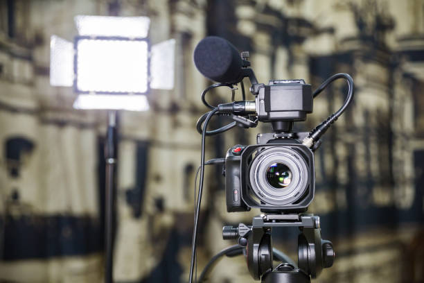 istock Shooting a report in the interior. Video equipment: camera, on-camera microphone gun, led lighting device, tripod 1132323430