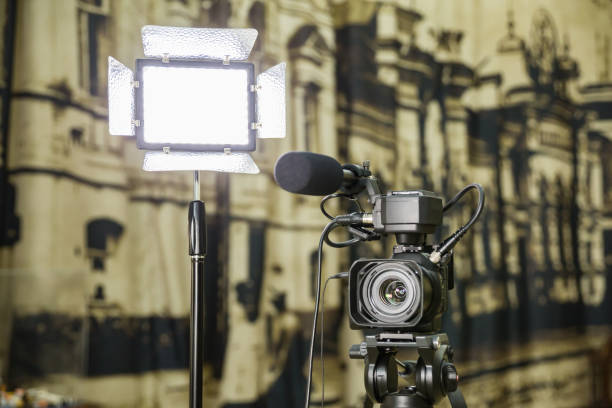 istock Shooting a report in the interior. Video equipment: camera, on-camera microphone gun, led lighting device, tripod 1132323439