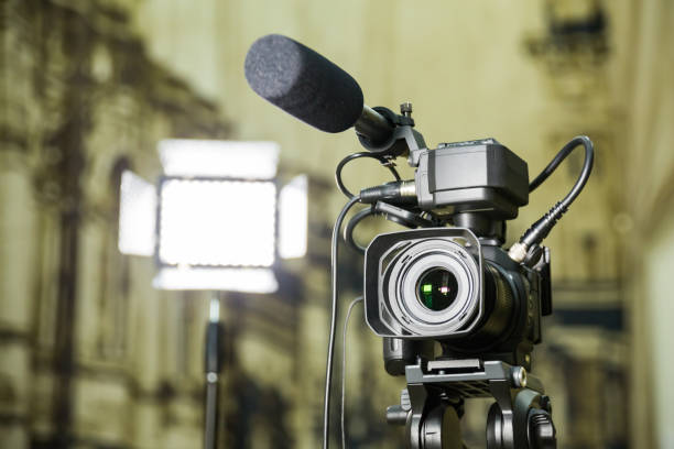 istock Shooting a report in the interior. Video equipment: camera, on-camera microphone gun, led lighting device, tripod 1132323444