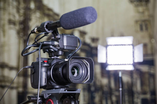 istock Shooting a report in the interior. Video equipment: camera, on-camera microphone gun, led lighting device, tripod 1132323459
