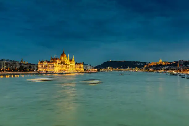 Cityscape of Budapest with landmarks including The Hungarian Parliament Building, The Royal Palace, Chain Bridge and Gellert Hill at night