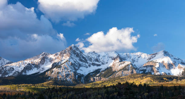 istock Mount Sneffels is within the Uncompahgre National Forest. An early fall snowstorm covers the peaks. 1132323578